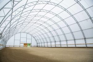 CC Series Fabric Structure on Wood Posts for an Equine Indoor Riding Arena